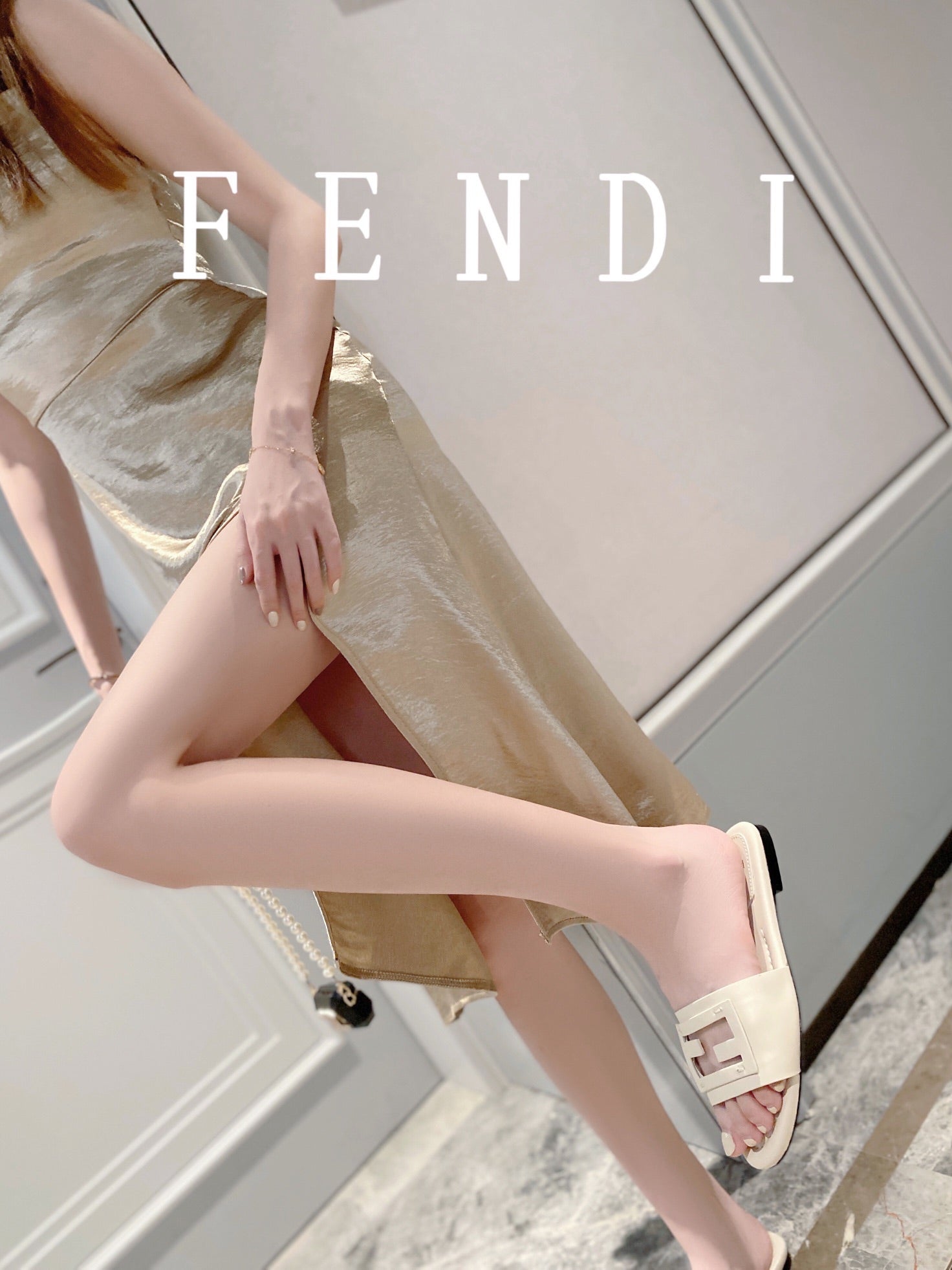 FENDI BAGUETTE SLIDES IN WHITE LAMBSKIN