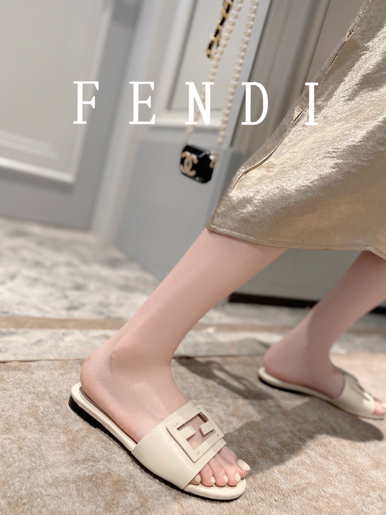FENDI BAGUETTE SLIDES IN WHITE LAMBSKIN