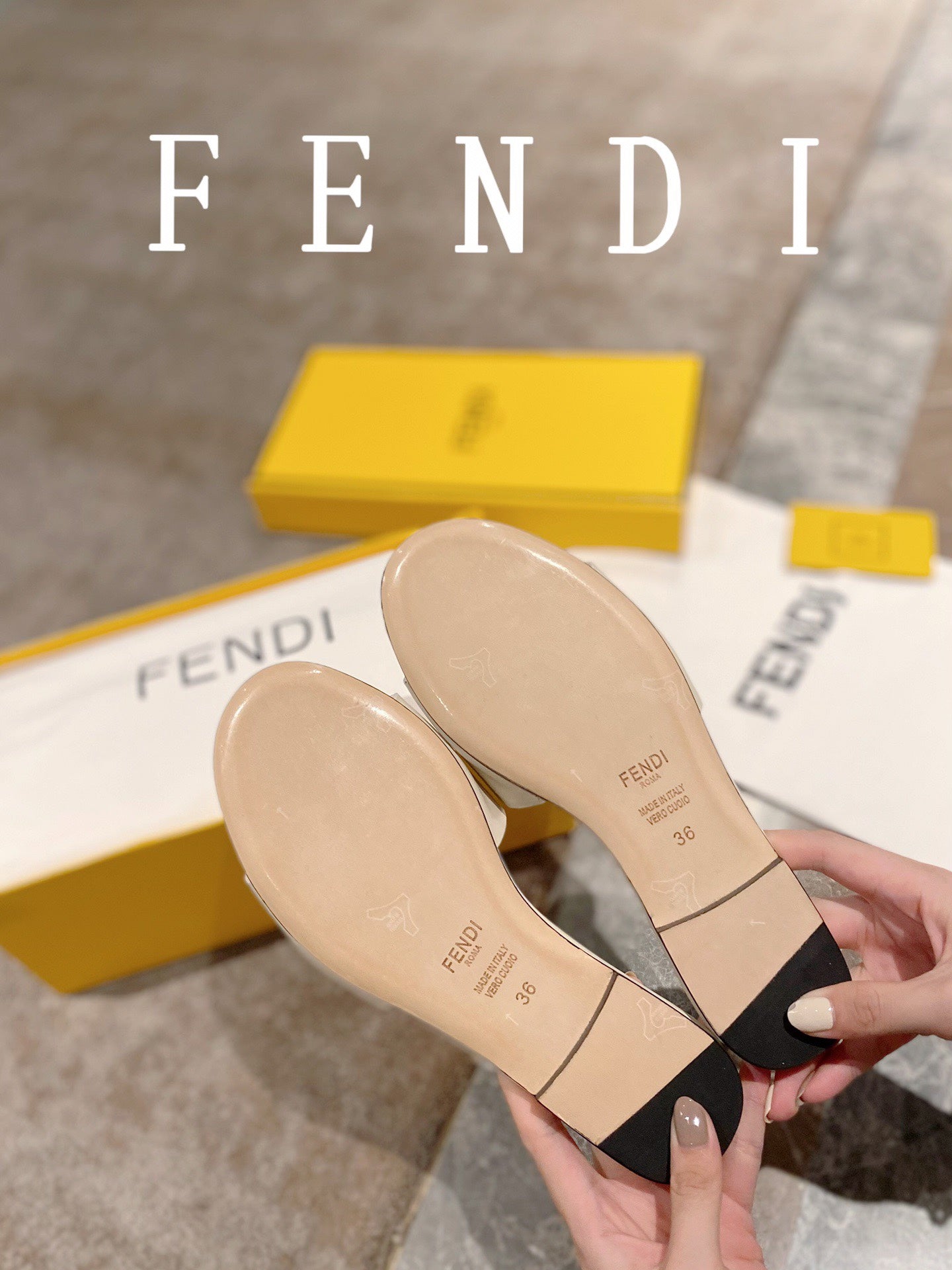 FENDI BAGUETTE SLIDES IN WHITE LAMBSKIN