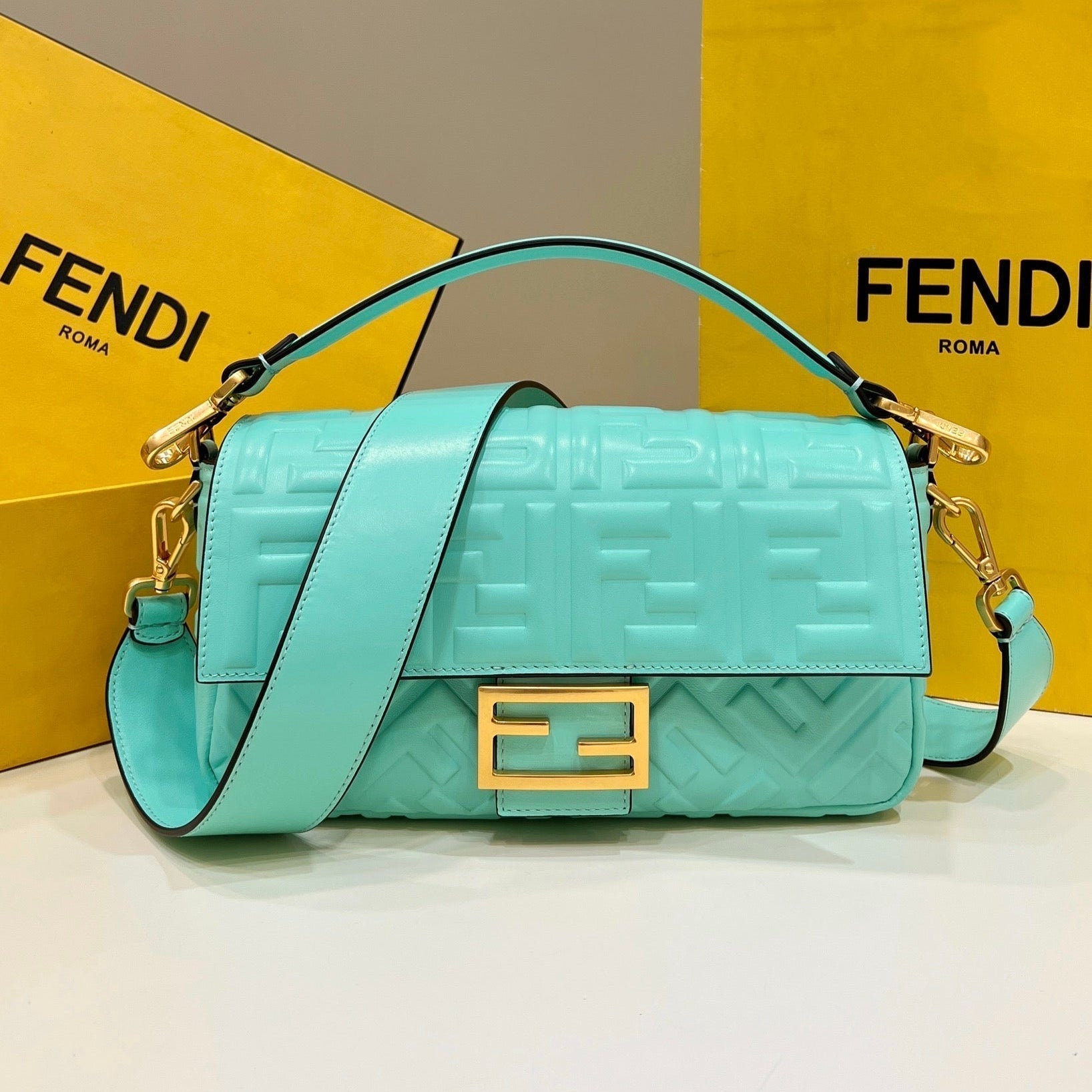 BAGUETTE WITH FF MOTIF 27 IN TURQUOISE SOFT LAMBSKIN GOLD HARDWARE