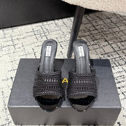 ALAIA  Muller high-heeled black woven leather