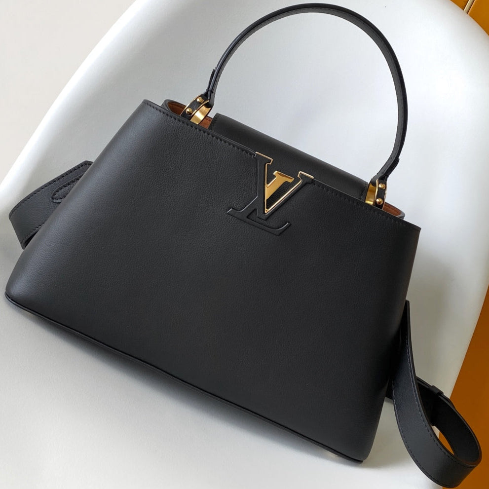 CAPUCINES GM 33CM BLACK GOLD TAURILLON LEATHER 252021