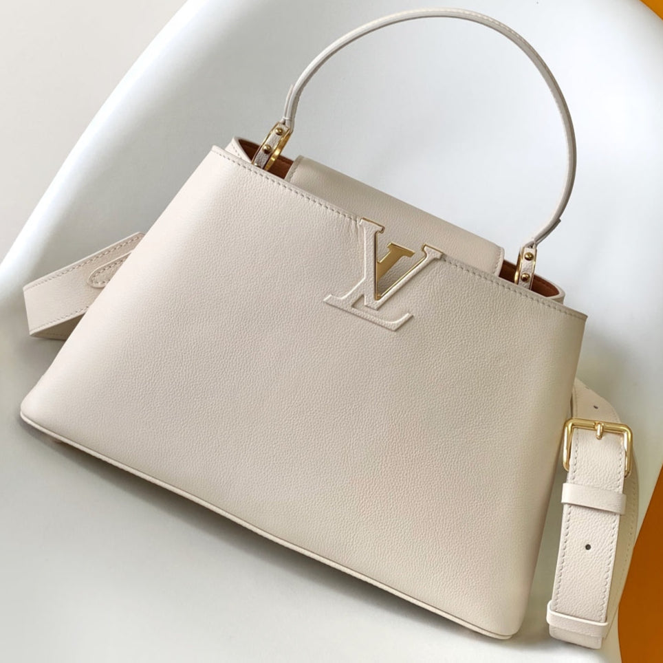 CAPUCINES GM 33CM BEIGE GOLD TAURILLON LEATHER 252023