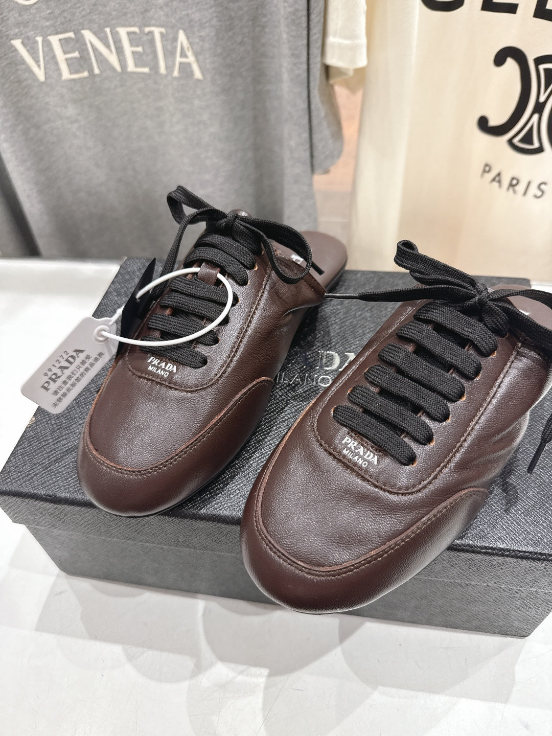 Prada 25s mule dark brown sheepskin 535501