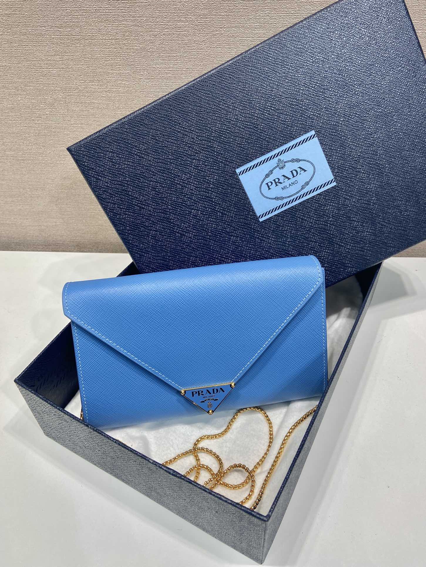 PRA Cross pattern envelope bag blue leather 341158