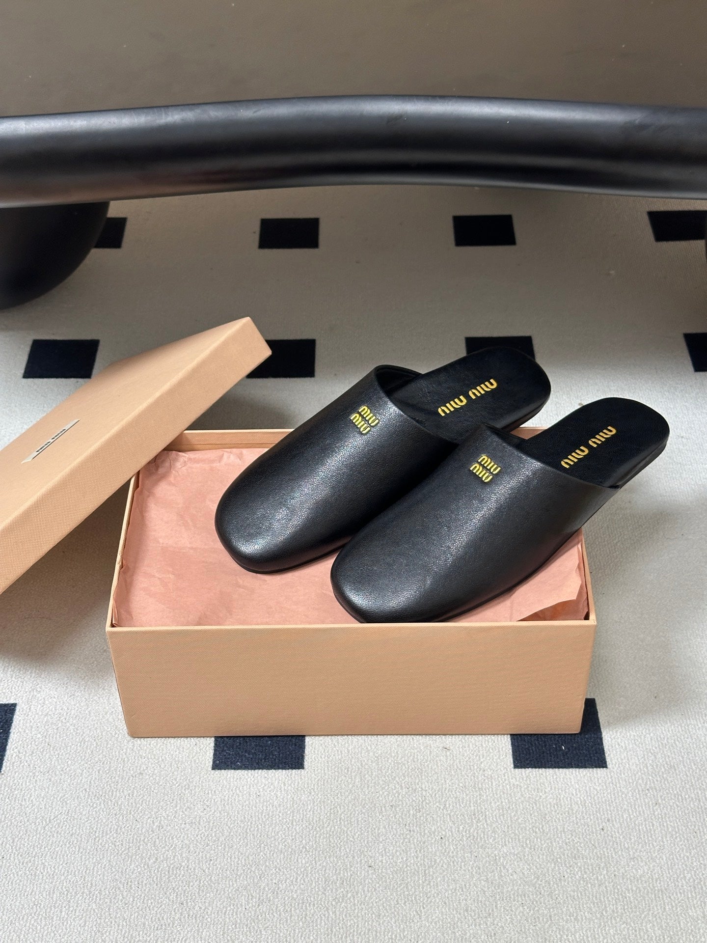 Miu Miu 2026 Flat Closed-Toe Mule Black Cowhide 994104