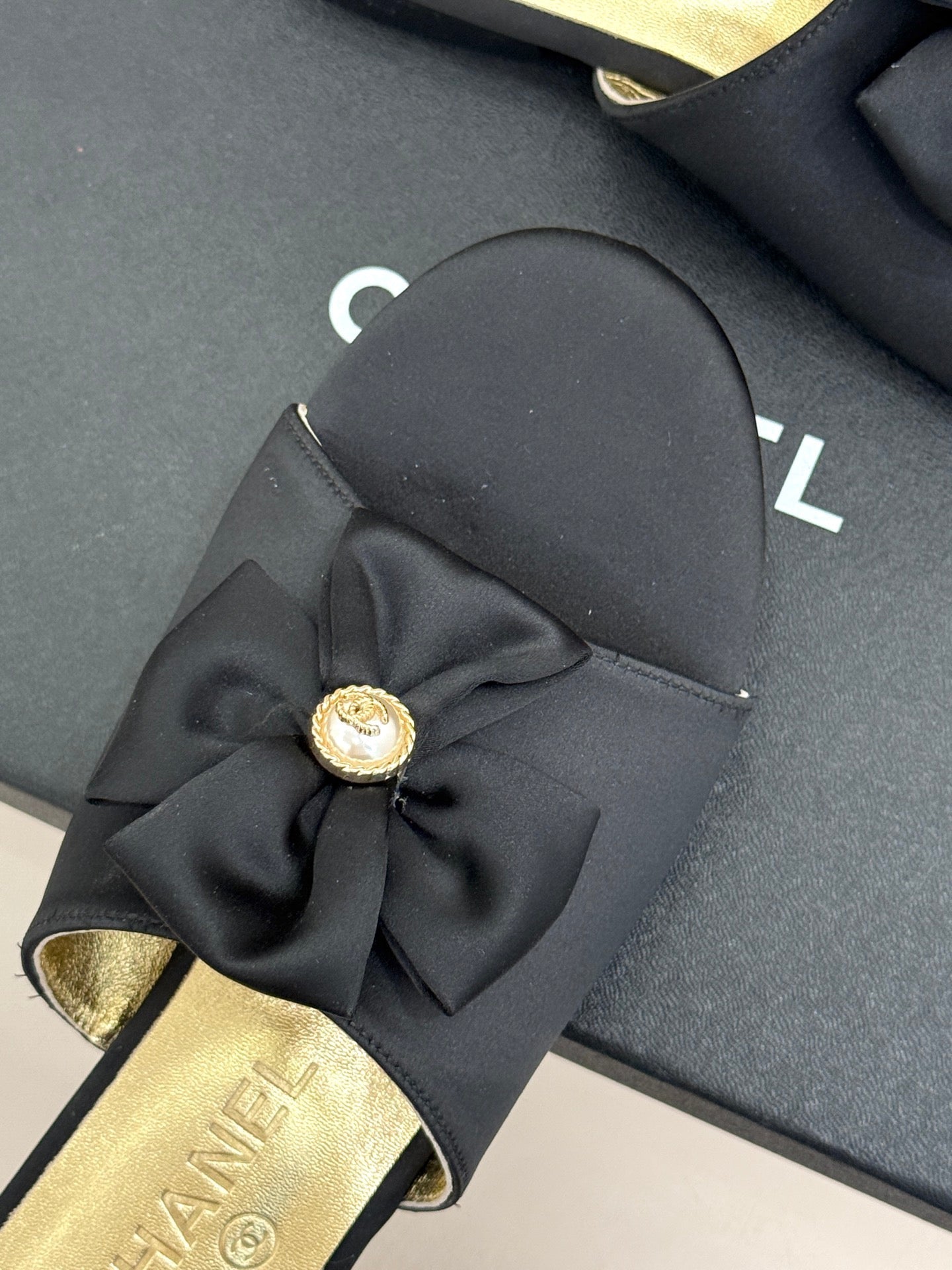 CC 26 Bow Flat Sandal Black Gold Satin Sheepskin 609799