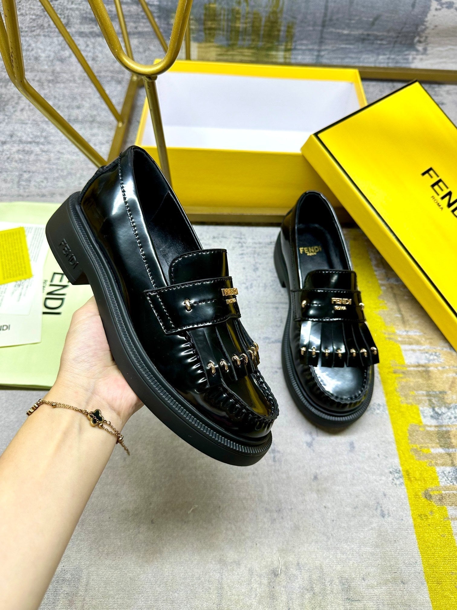 FENDI BAGUETTE LOAFERS IN BLACK CALFSKIN WITH GOLD HARDWARE