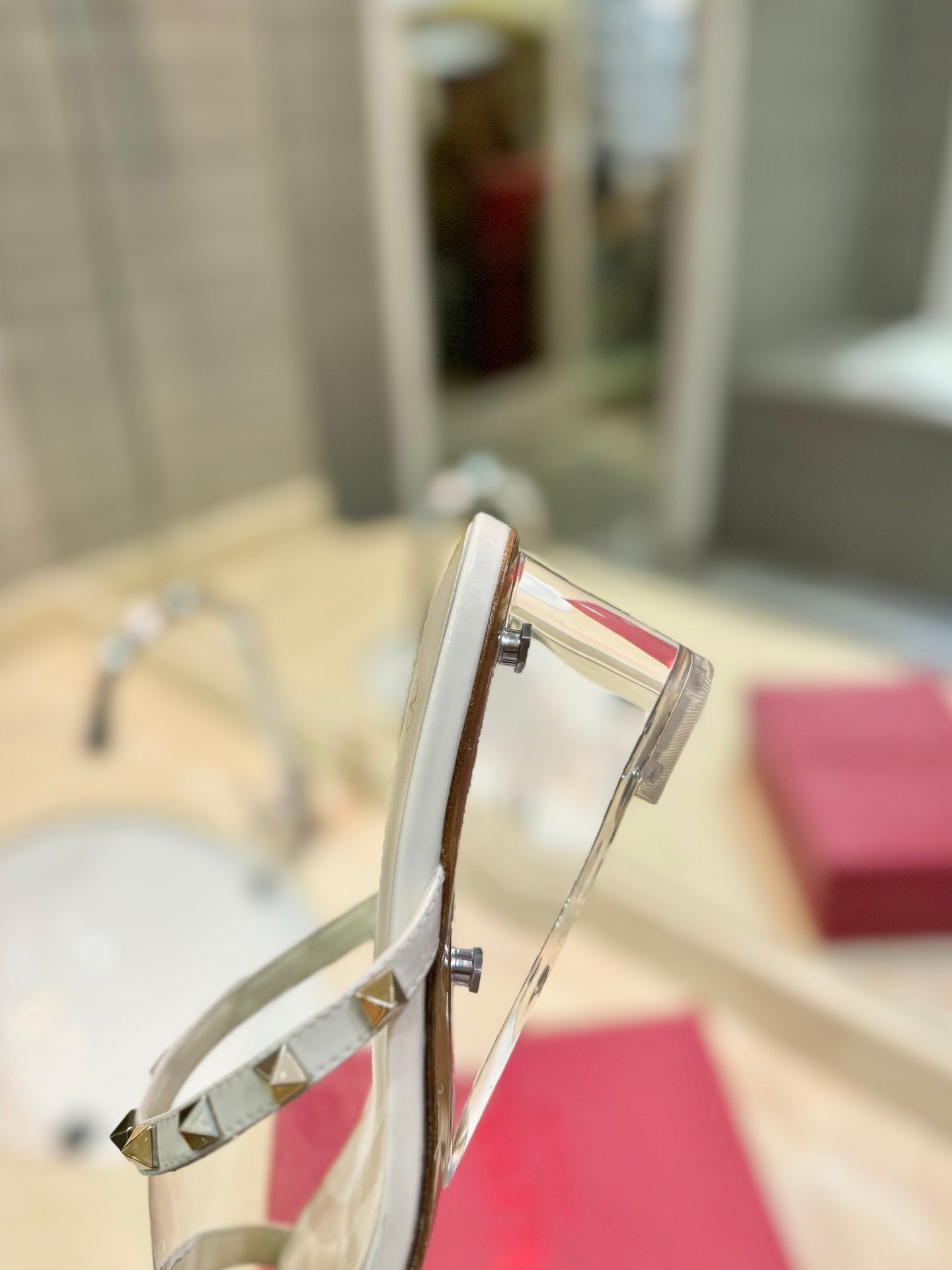 ROCKSTUD MULE SANDALS IN WHITE CALFSKIN AND TRANSPARENT PVC FILM