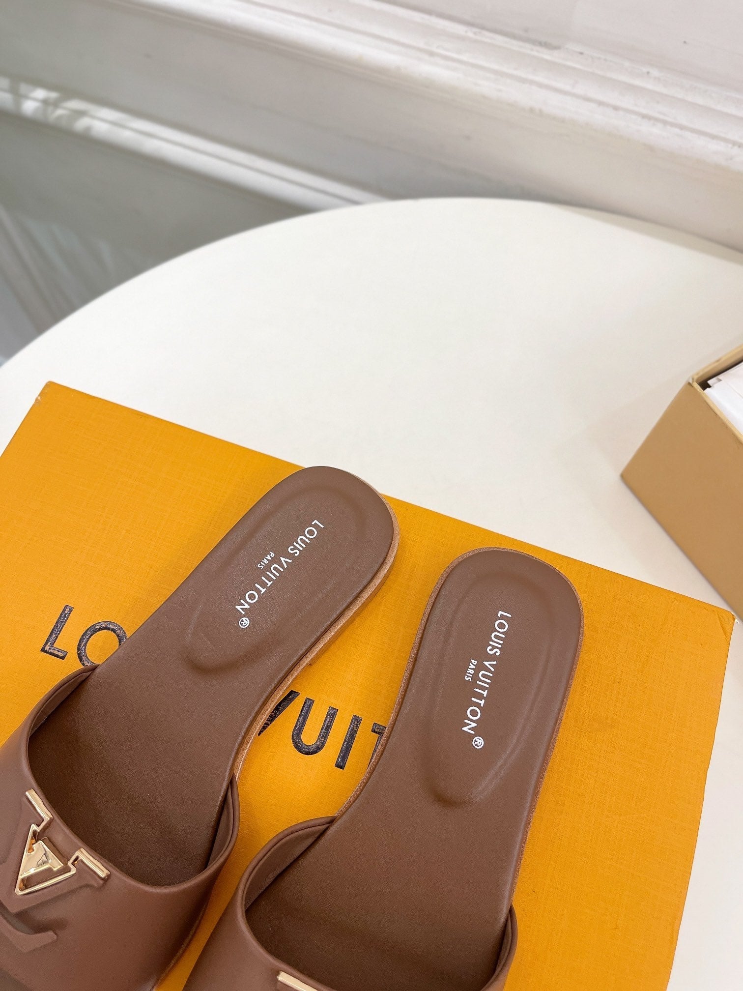 lv capri flat mule chocolate calfskin